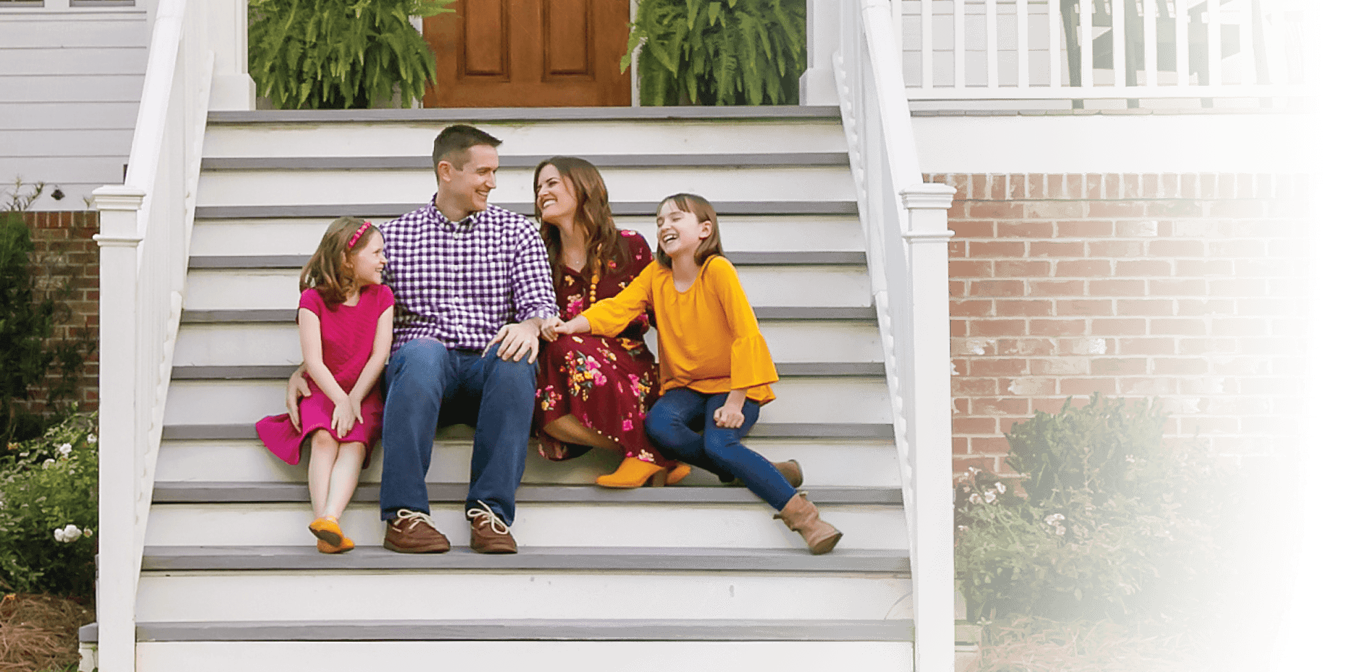 family smiling for picture