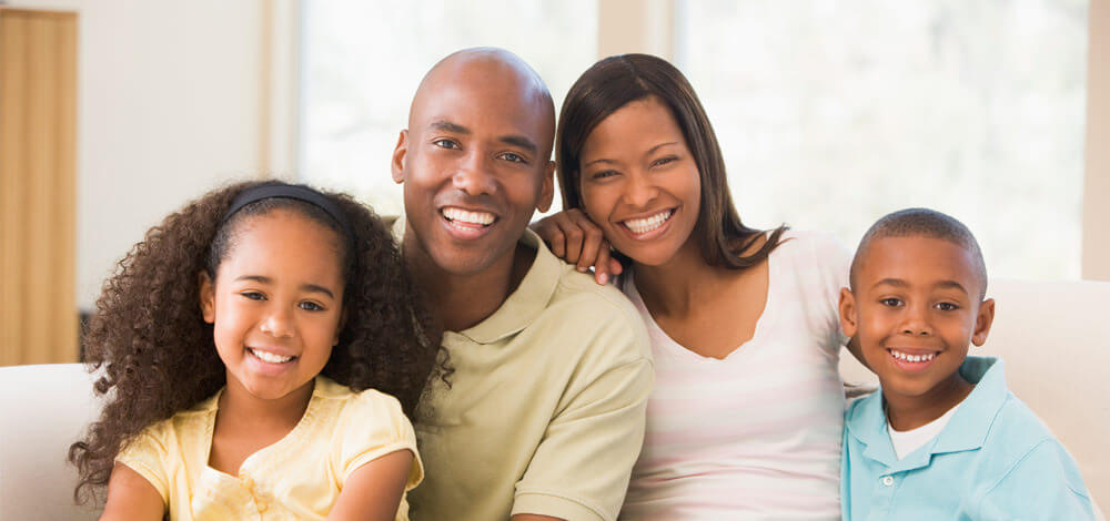 family smiling for picture