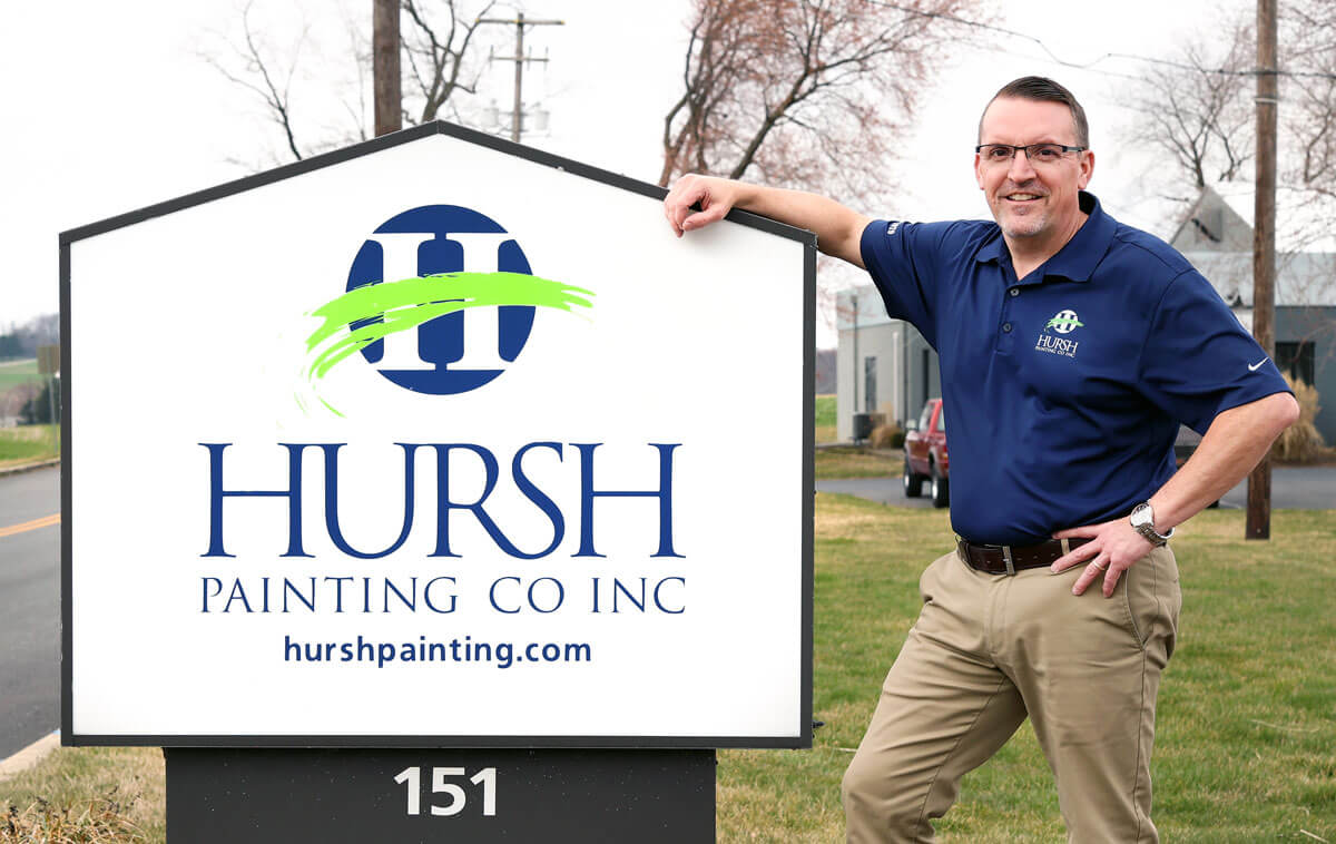 Phil Hursh with Sign