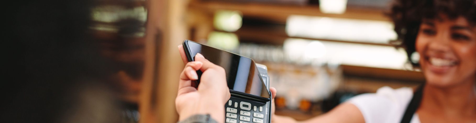 Customer paying bill using smartphone