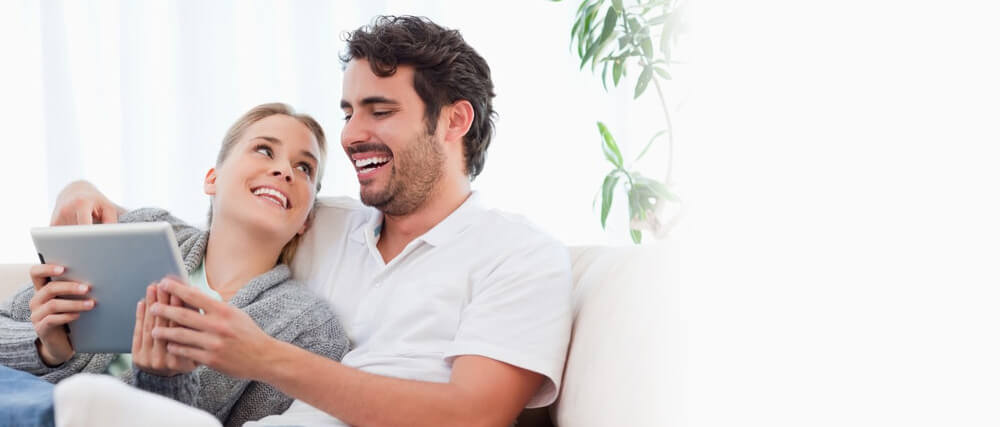 couple looking at tablet