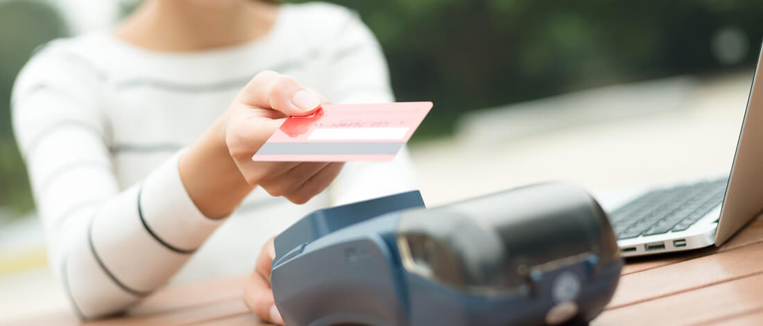 woman paying with credit card